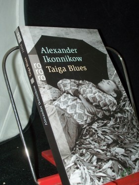 Artikelbild des Artikels “Taiga Blues / Alexander Ikonnikow. Aus dem Russ. von Annelore Nitschke “