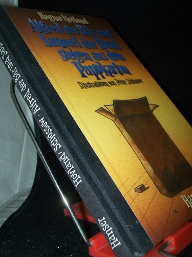 Artikelbild des Artikels “Alfred der Bär und Samuel der Hund steigen aus dem Pappkarton / Ragnar Hovland. Ill. von Peter Schössow. Aus dem Norweg. von Gabriele Haefs “