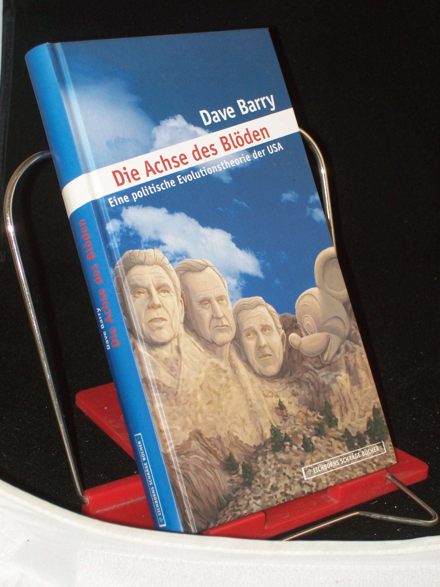Artikelbild 1 des Artikels “Die Achse des Blöden : eine politische Evolutionstheorie der USA / Dave Barry. Aus dem amerikan. Engl. von Edith Beleites “