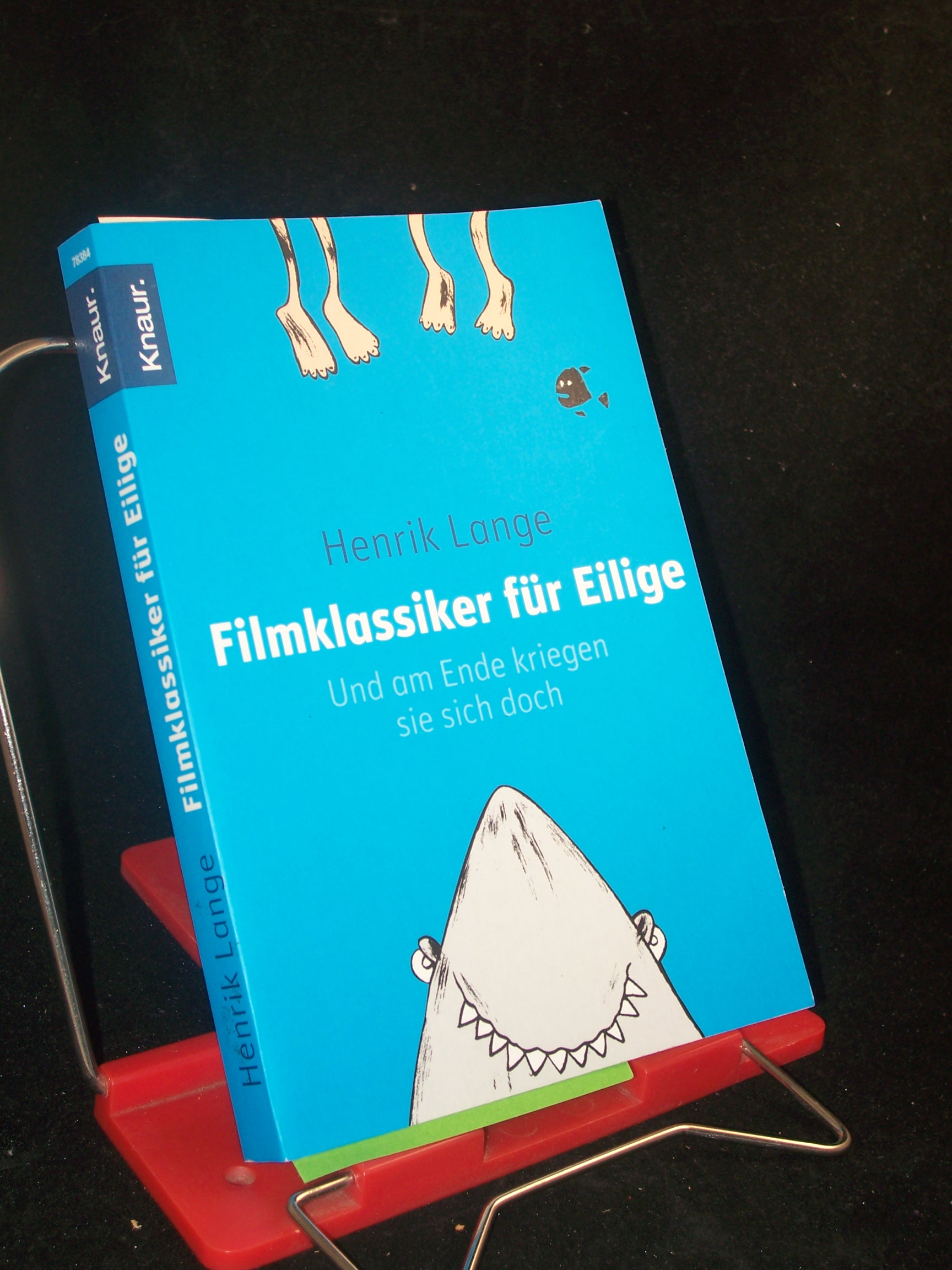 Artikelbild 1 des Artikels “Filmklassiker für Eilige und am Ende kriegen sie sich doch / Henrik Lange. Aus dem Engl. von Marko Jacob “
